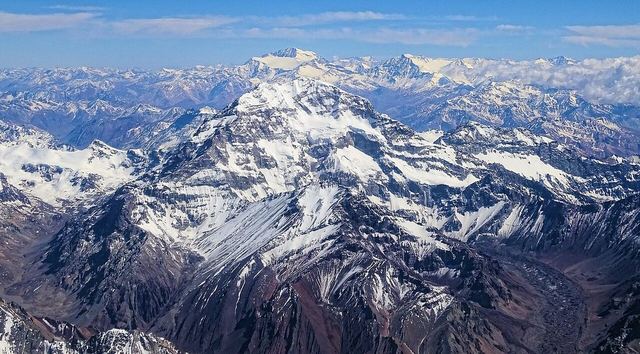Aconcagua seen from a commercial flight between Buenos Aires, Argentina, and Santiago de Chile in December 2016. In the background we also see the mountain Mercedario.