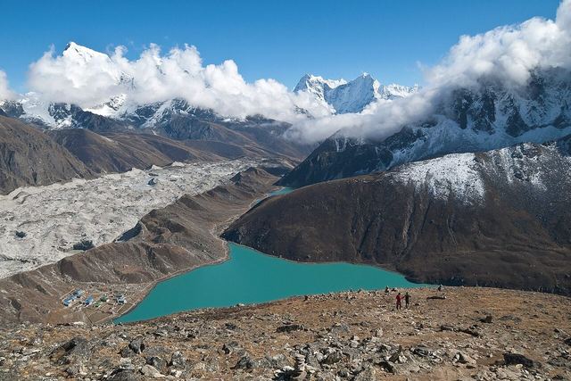 The summit of Gokyo Ri. Ngozumpa glacier, the largest and longest glacier in the Himalayas, is right below, along with commanding views over nearby Cholatse, Taboche, Kangtega, Thamserku and other pea